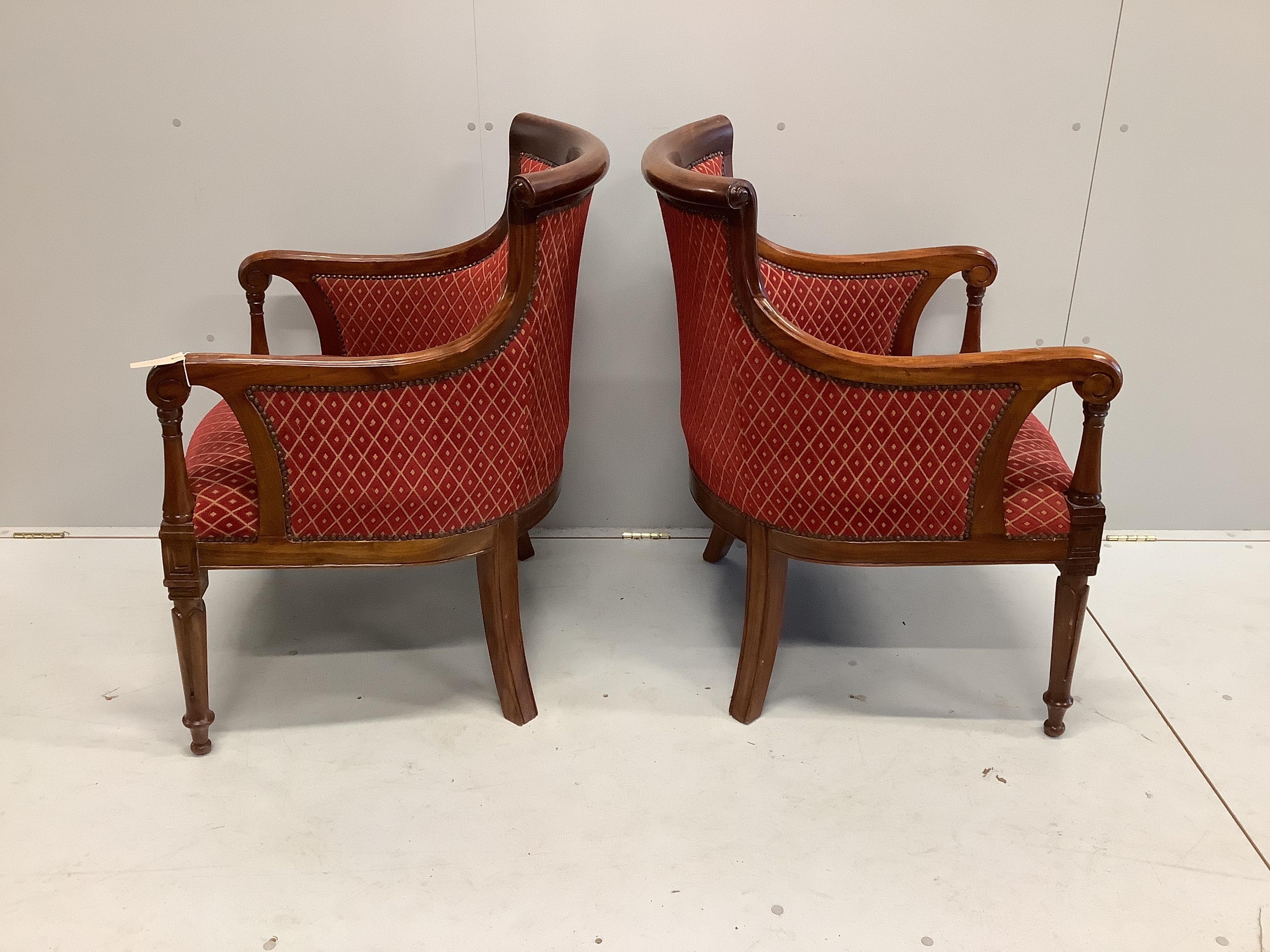 A pair of Empire style upholstered mahogany armchairs, width 65cm, depth 56cm, height 92cm